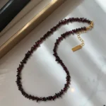 Pomegranate Necklace on Floor