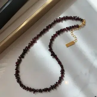Pomegranate Necklace on Floor